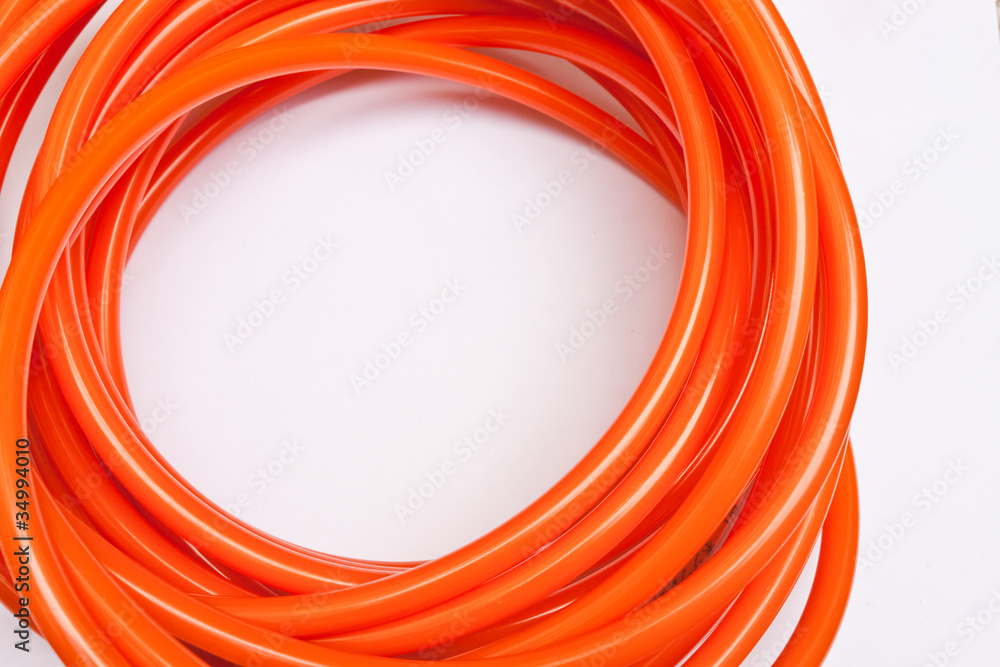Orange garden hose coiled Orange garden hose coiled