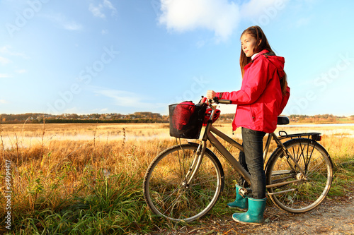 Autumn / fall woman biking
