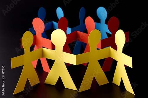 A group of red yellow and blue paper men