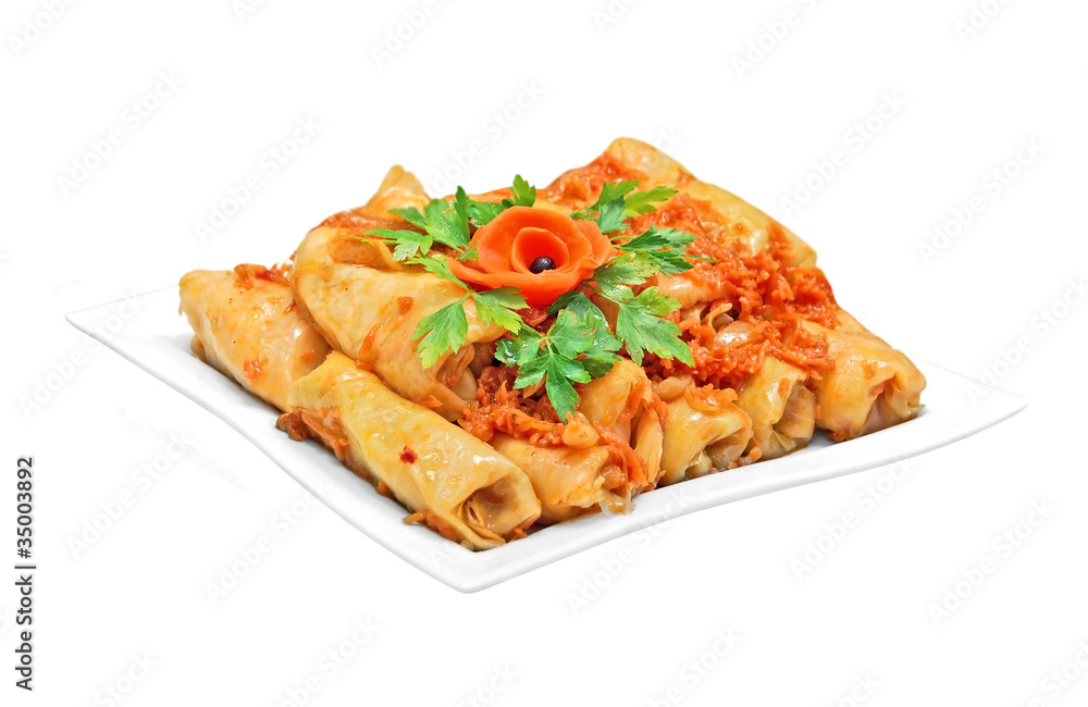 Stuffed cabbage roll on plate, isolated on white background Stuffed cabbage roll on plate, isolated on white background
