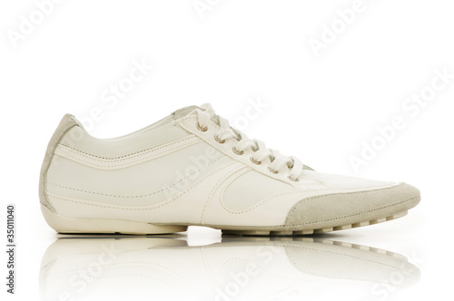 Sport shoes on white background © Elnur