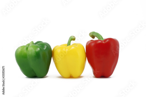 Green, Red And Yellow Capsicum In A Row