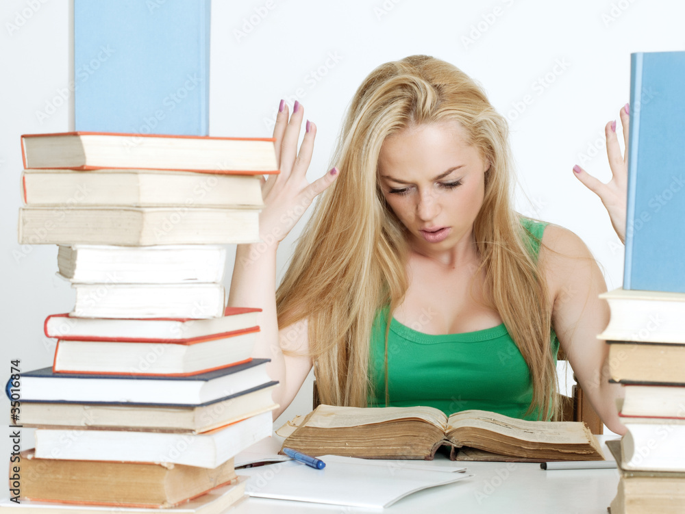 Beautiful blonde studying for an examination Beautiful blonde studying for an examination