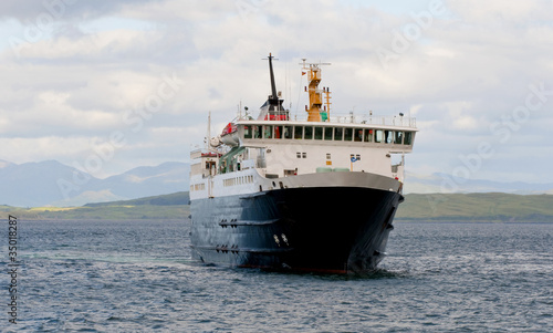 A ferry sails in the scottish highlands