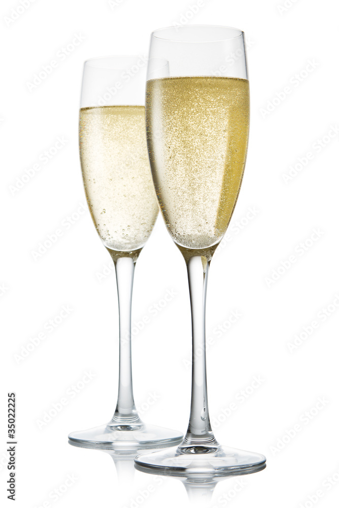 Two glasses of champagne. Isolated on white backgroun Two glasses of champagne. Isolated on white backgroun