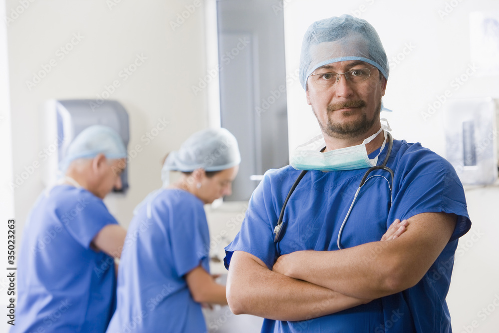 Surgeons scrubbing in before operating Surgeons scrubbing in before operating