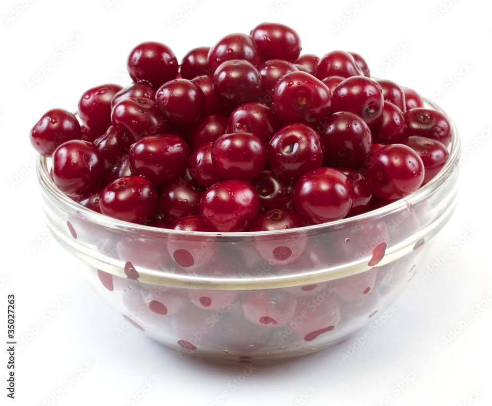 Bowl with ripe cherries. Isolated on a white background. Bowl with ripe cherries. Isolated on a white background.