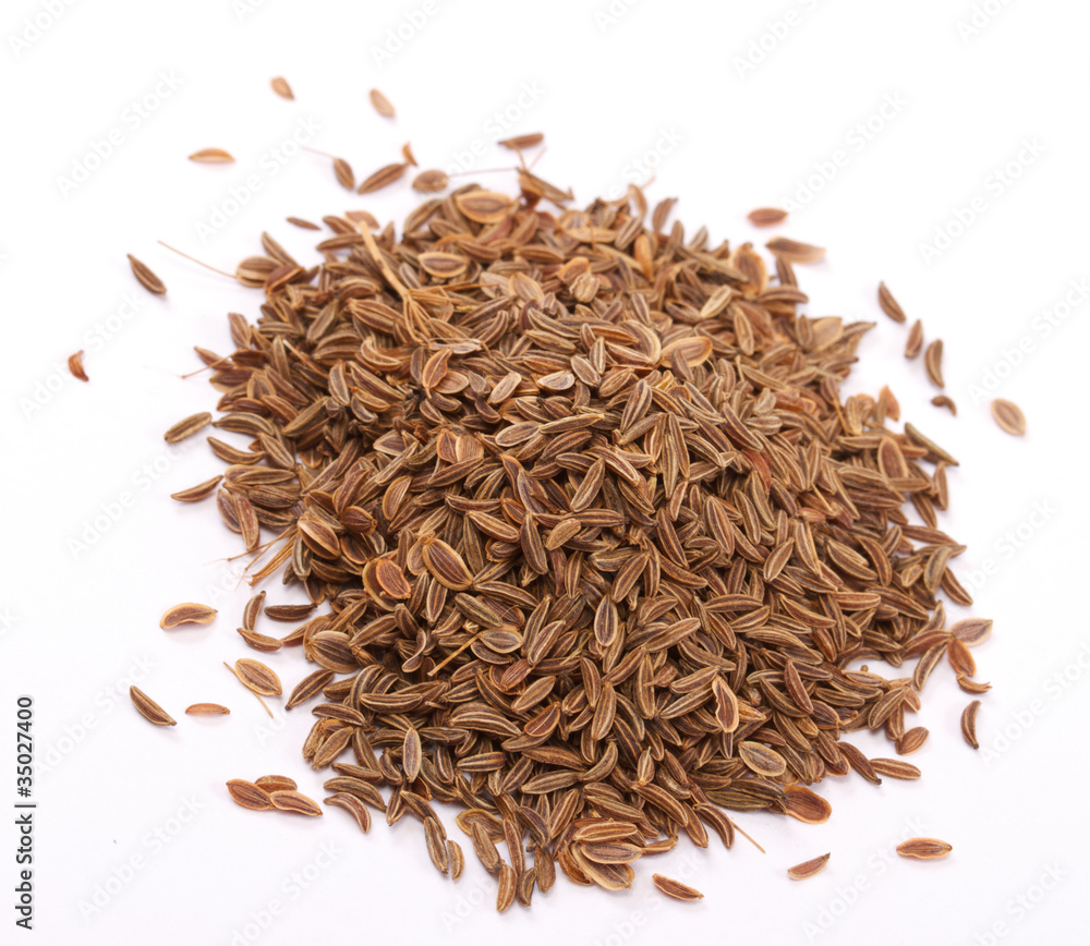 Fototapeta premium pile dill seeds on white background
