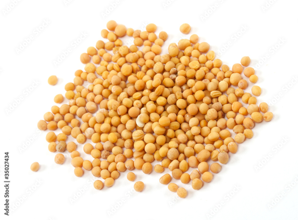 Yellow mustard seeds isolated on white background Yellow mustard seeds isolated on white background