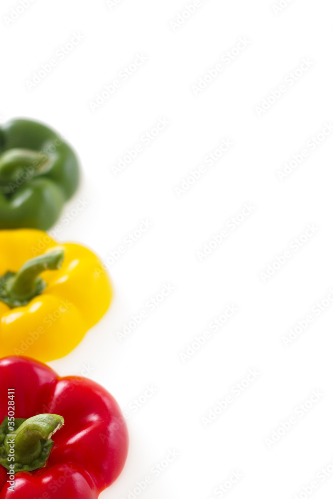 Three colorful bell pepper tops with copy space Three colorful bell pepper tops with copy space