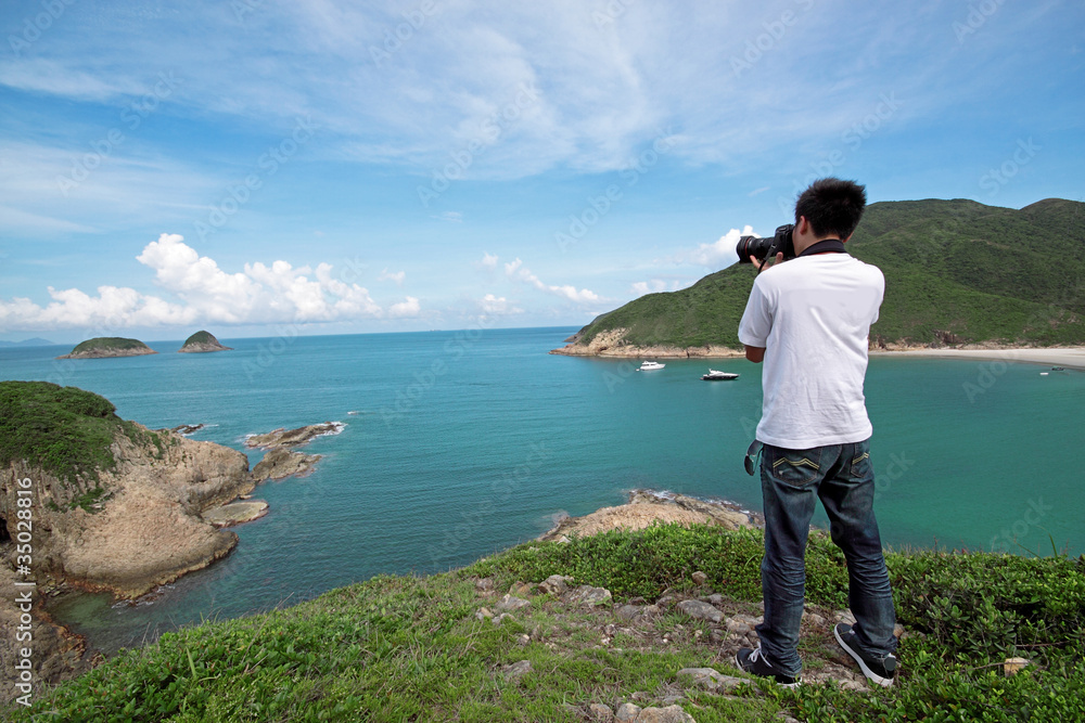 photographer takes a photo of the landscape