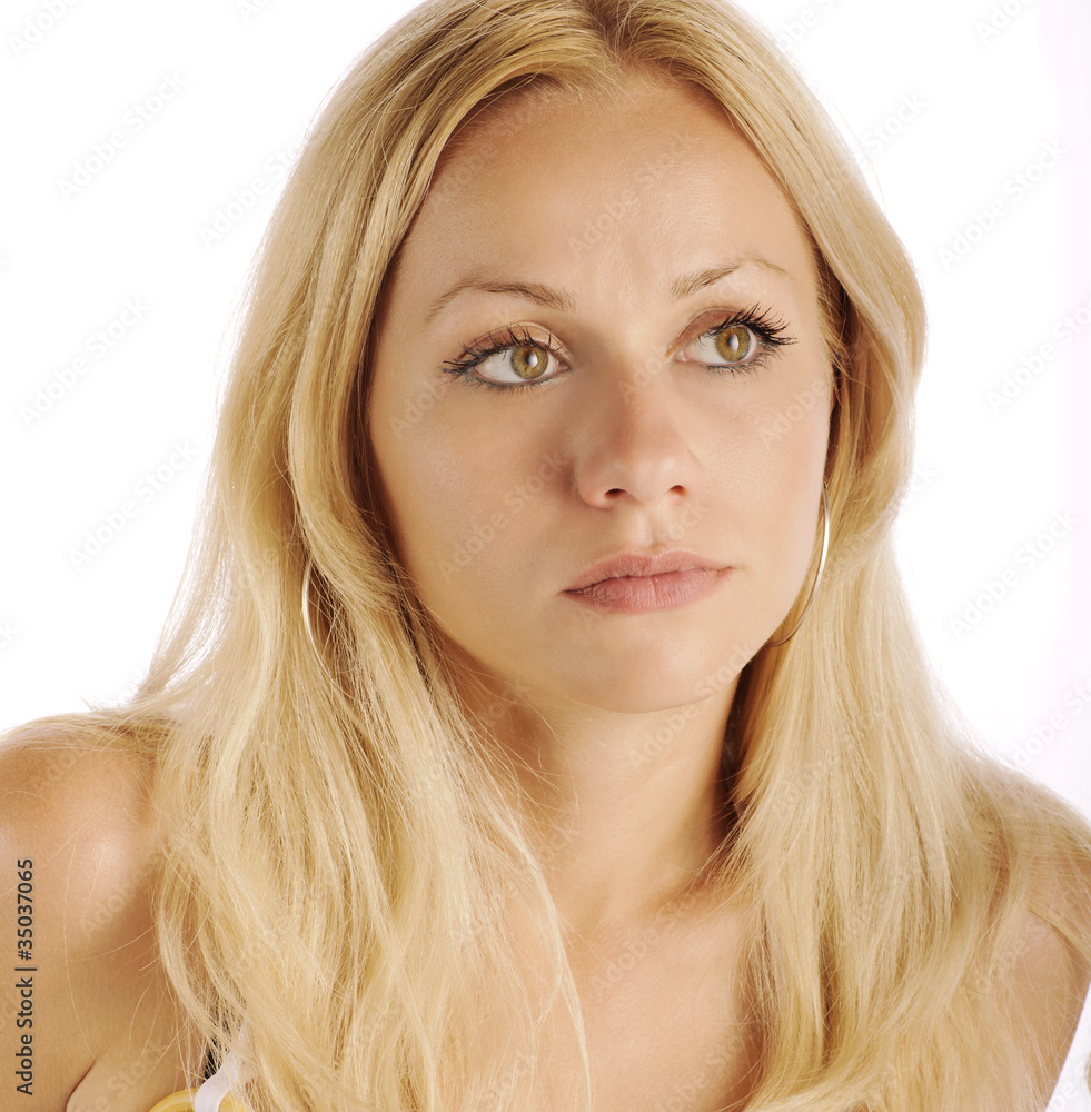 Beautiful blond girl with serious expression, isolated Beautiful blond girl with serious expression, isolated