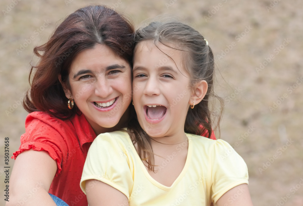 Latin girl with her mother in a park Latin girl with her mother in a park