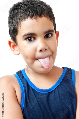 Small latin boy with a funny face isolated on white photo