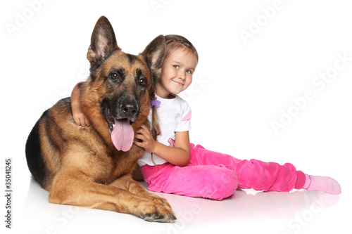 Young girl and German shepherd dog