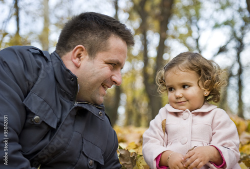 Portrait with dad and daughter talking