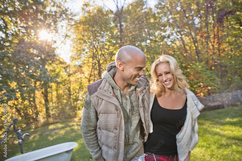 Couple walking in park in autumn Couple walking in park in autumn