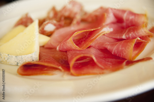 Close up of cheese and  prosciutto photo