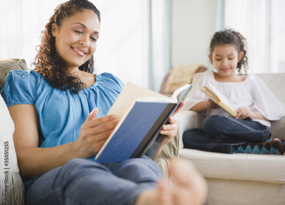 Mother and daughter reading books Mother and daughter reading books