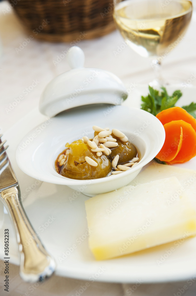 Tuscan baked onion with pine nuts and sheep's milk cheese Tuscan baked onion with pine nuts and sheep's milk cheese