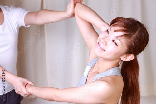 young japanese woman getting Thai massage
