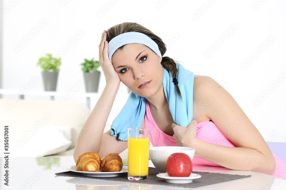 sportive woman having breakfast sportive woman having breakfast