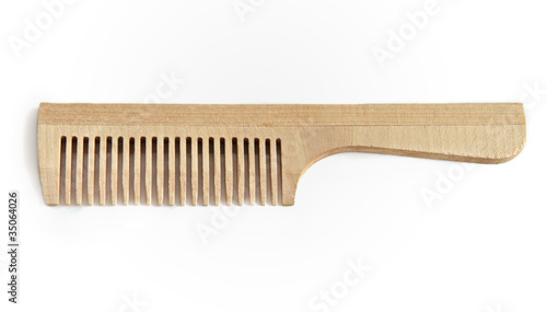 Wooden comb on a white background