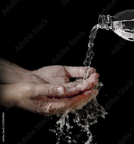 water flowing into hand
