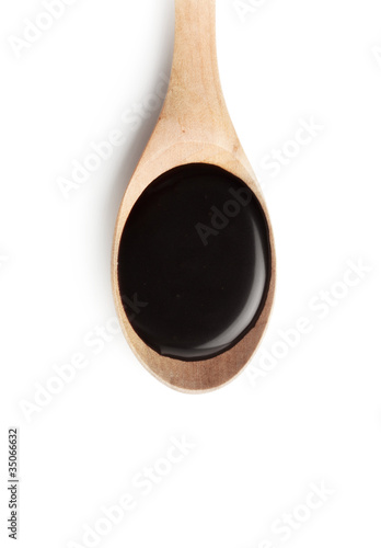 Chocolate syrup on a spoon