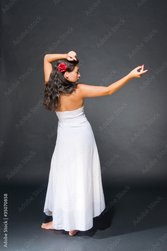 Fototapeta premium Dancing young dark haired beautiful woman