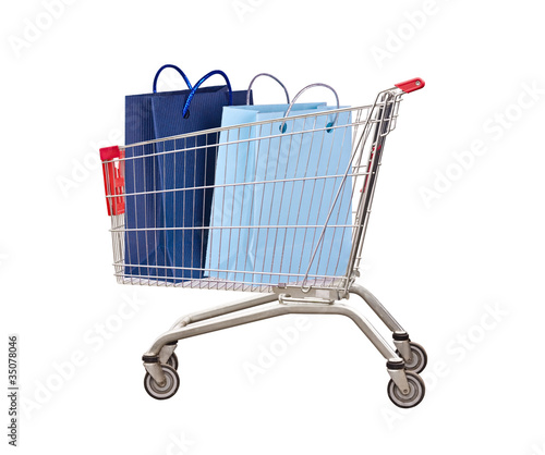 Cart for purchases with bags on the white