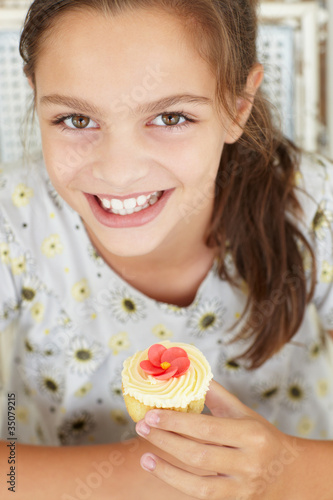 Young girl with cupcake