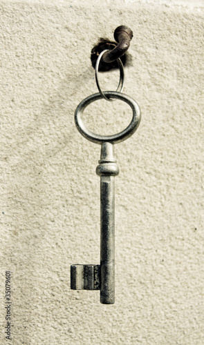 key on an old nail clogged at the wall © Vira Monastyrska