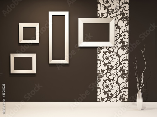 Showroom. Empty frames on the black wall with decoration