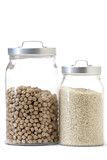 A pair of glass jar with rice and chickpeas