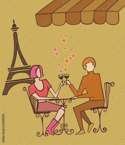 Couple in Paris couple celebrating with champagne