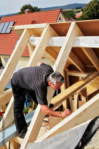 carpenters constructing a dormer