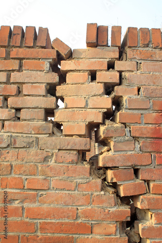 crack of red brick wall