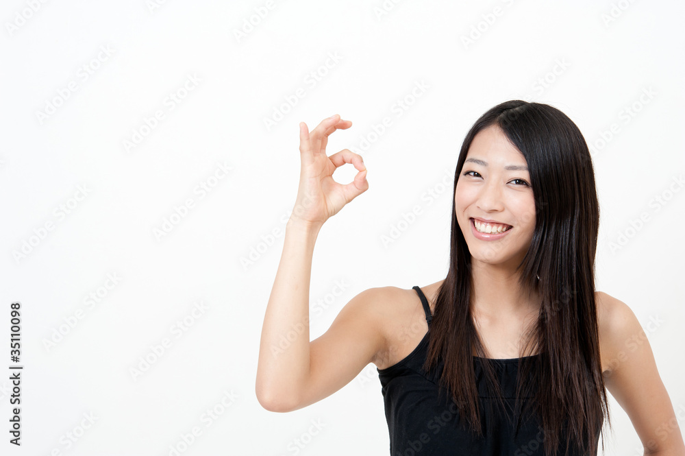 a portrait of attractive asian woman showing okay a portrait of attractive asian woman showing okay