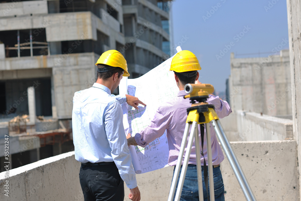 Team of architects on construciton site Team of architects on construciton site
