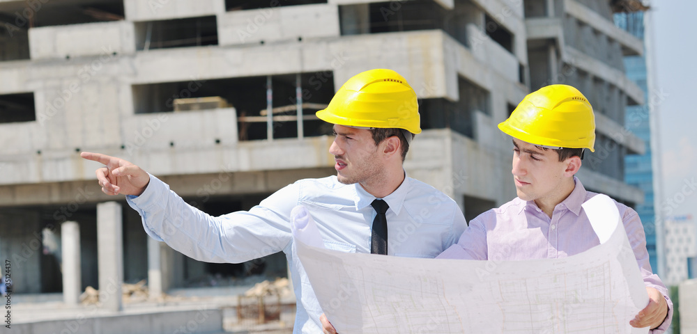 Team of architects on construciton site Team of architects on construciton site