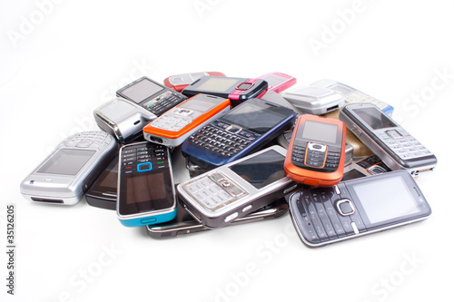 Stack of cell phones, isolated on white