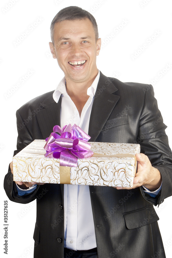 The happy smiling man with a celebratory gift The happy smiling man with a celebratory gift