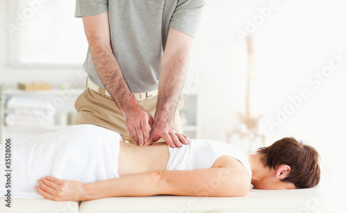 Brunette woman getting a back-massage