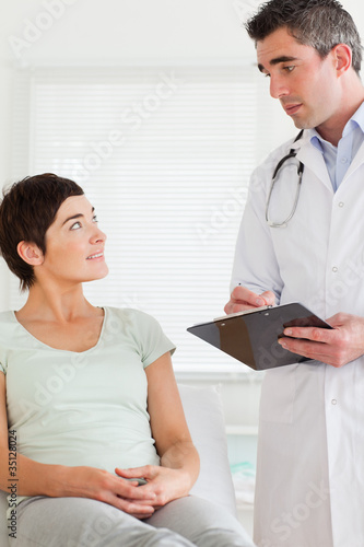 Male Doctor and female patient looking at each other
