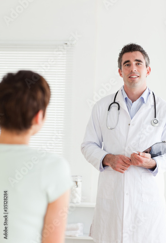Doctor talking to a brunette woman
