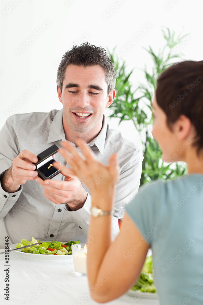 Man proposing to his charming girlfriend during dinner Man proposing to his charming girlfriend during dinner