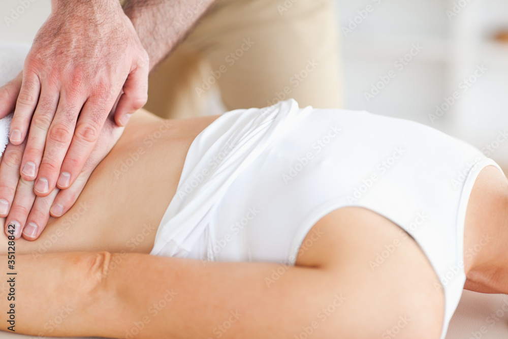 Lying Woman getting a massage