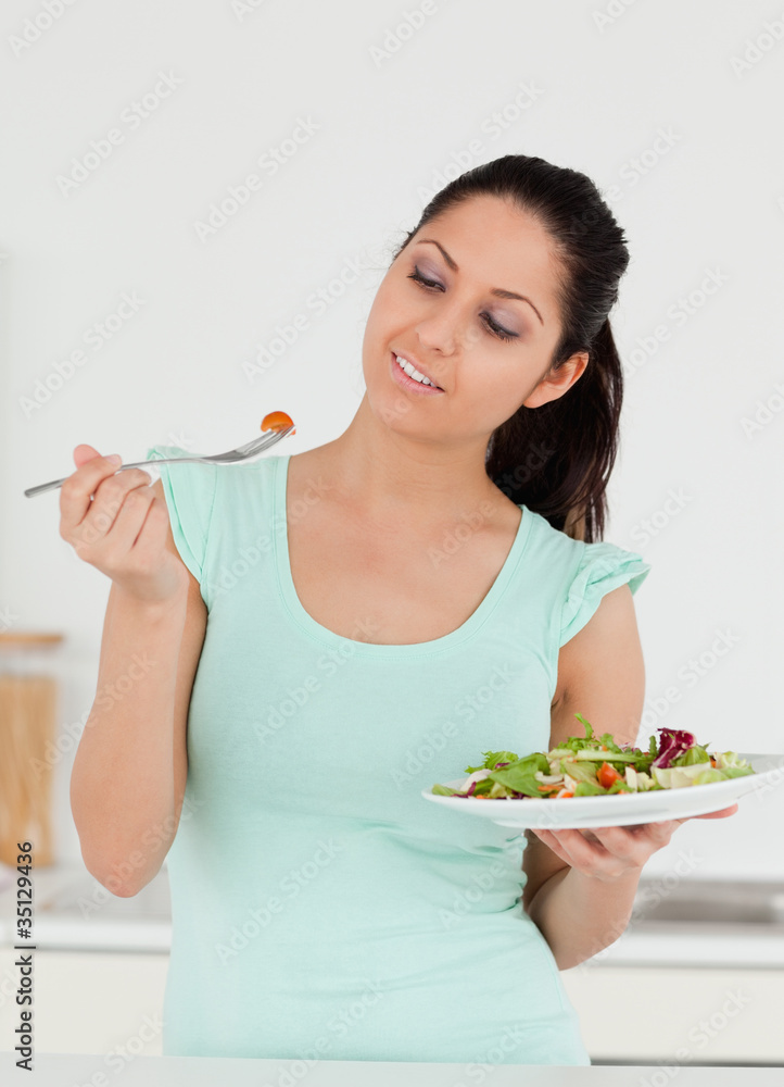 A young woman with salad