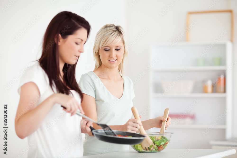 Beautiful Women cooking dinner